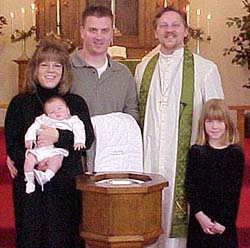 Dan and Jen Young with baby and Pastor Dan.